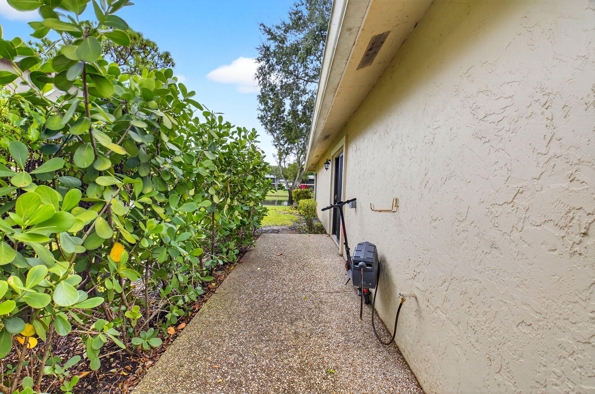 24 Westgate Lane, Unit A Boynton Beach, FL 33436 - Photo 36 of 94 Side Patio
