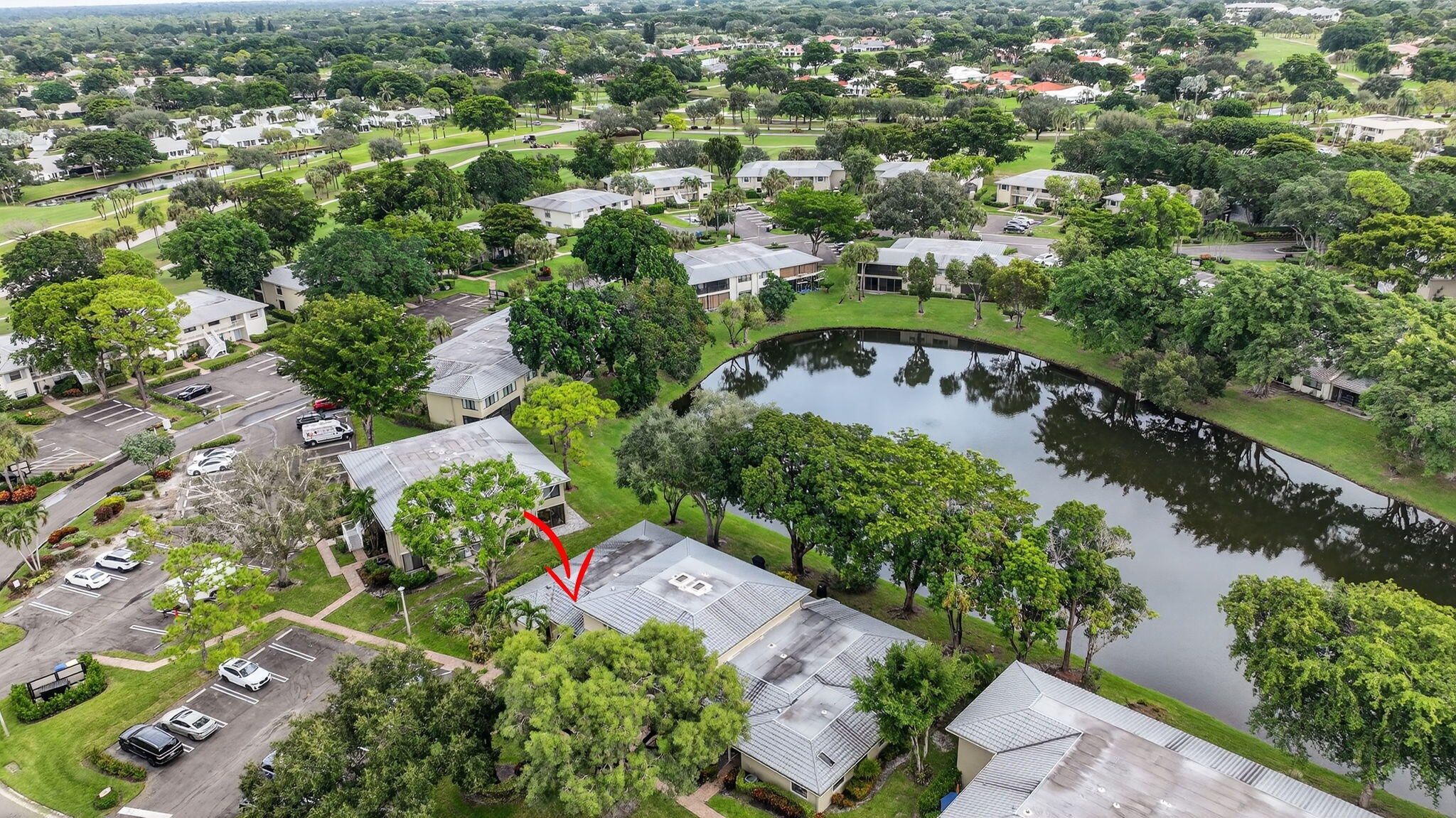 24 Westgate Lane, Unit A Boynton Beach, FL 33436 - Photo 43 of 94 an aerial view of residential houses with outdoor space and trees