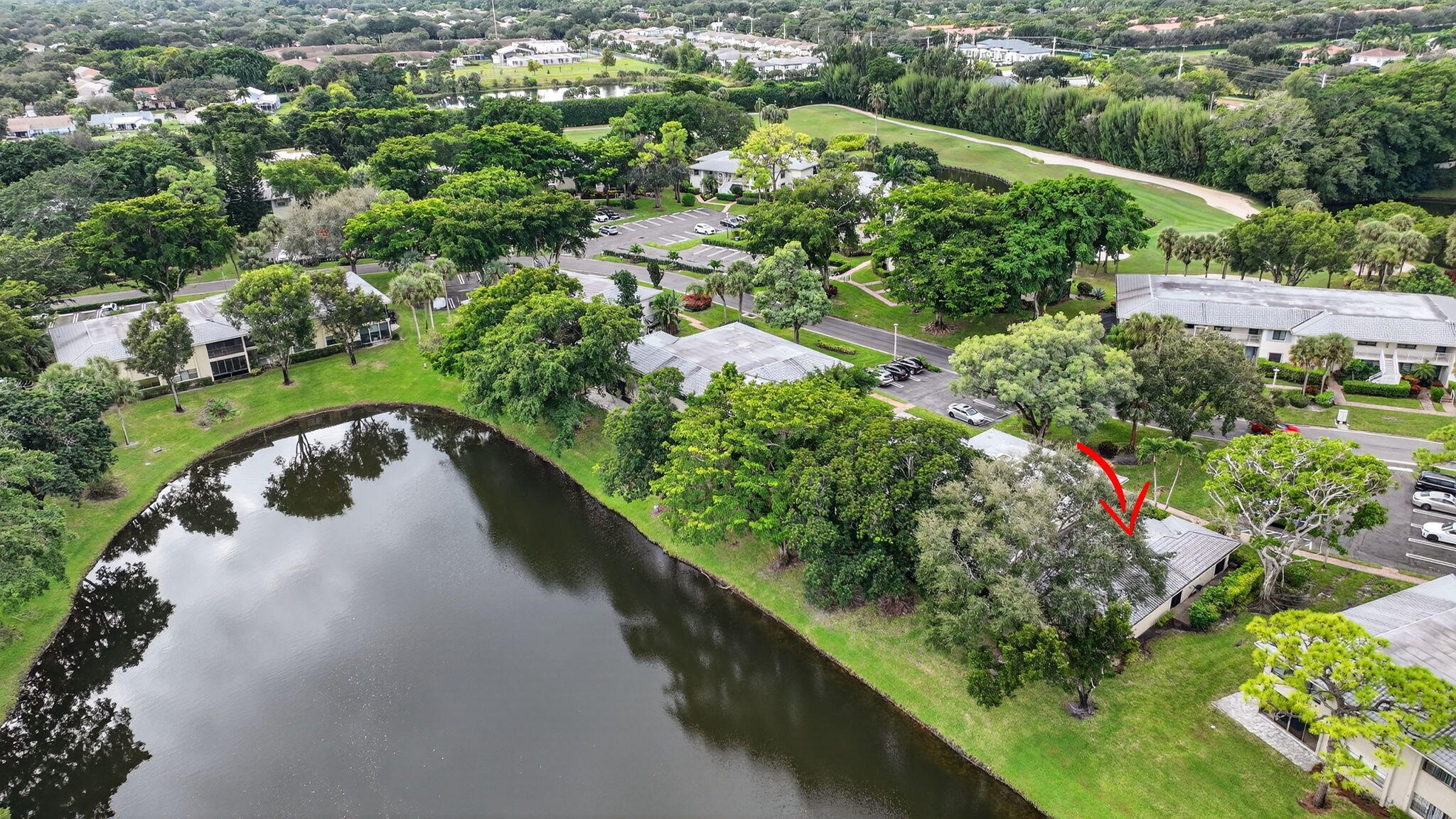 24 Westgate Lane, Unit A Boynton Beach, FL 33436 - Photo 47 of 94 an aerial view of a house with a yard and lake view