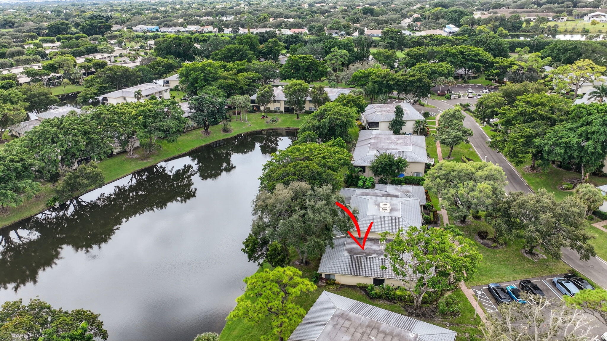 24 Westgate Lane, Unit A Boynton Beach, FL 33436 - Photo 48 of 94 an aerial view of a house with a yard and lake view