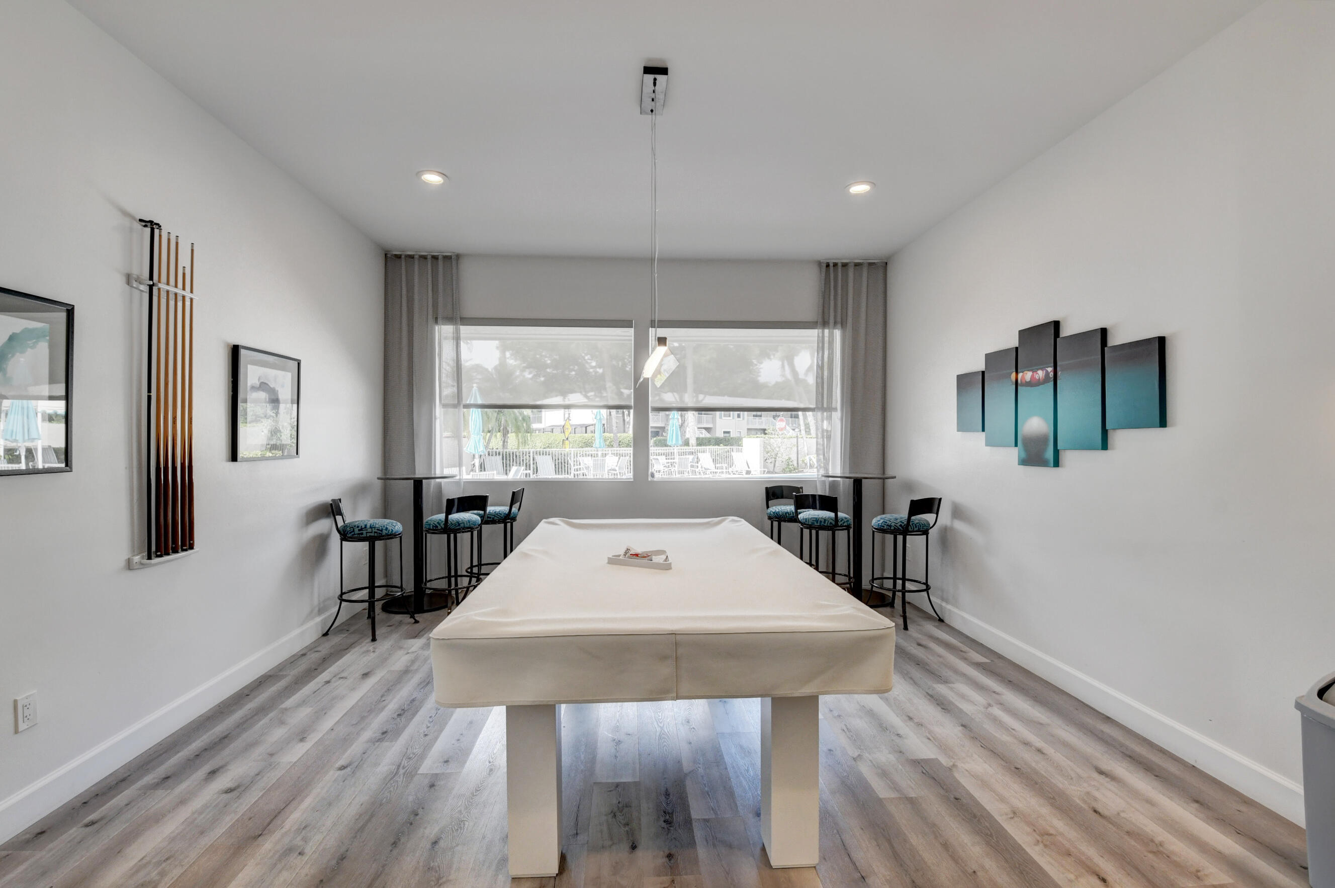 24 Westgate Lane, Unit A Boynton Beach, FL 33436 - Photo 61 of 94 a view of a dining room with furniture window and wooden floor