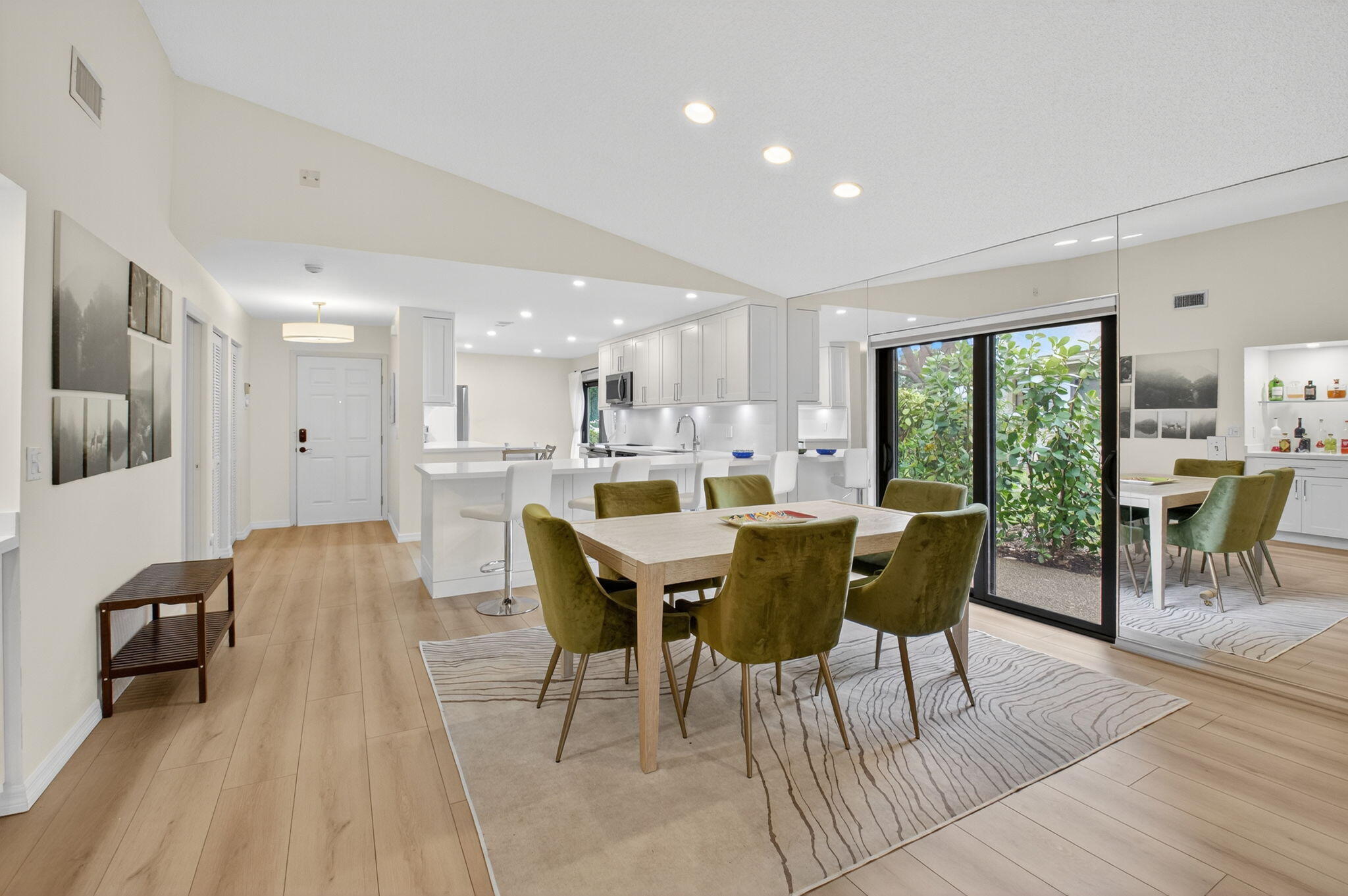 24 Westgate Lane, Unit A Boynton Beach, FL 33436 - Photo 7 of 94 a view of a dining room with furniture and wooden floor