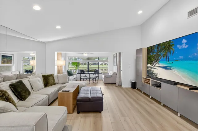 a bathroom with a sink vanity mirror and toilet