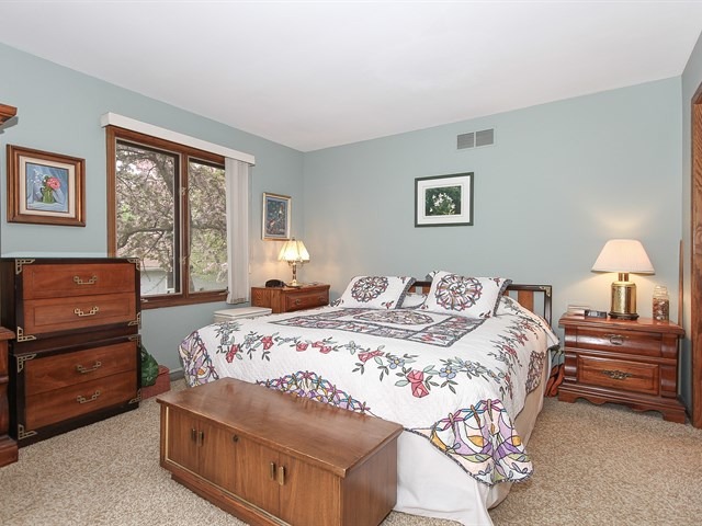 27 Green Ridge Road Elgin, IL 60120 - Photo 13 of 21 a bedroom with a bed and a dresser