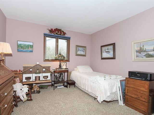 27 Green Ridge Road Elgin, IL 60120 - Photo 17 of 21 a bedroom with bed and a window