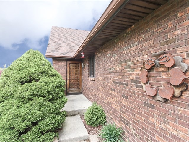 27 Green Ridge Road Elgin, IL 60120 - Photo 2 of 21 a pathway of a house with potted plants