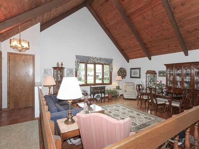 27 Green Ridge Road Elgin, IL 60120 - Photo 3 of 21 a view of a dining room with furniture and wooden floor