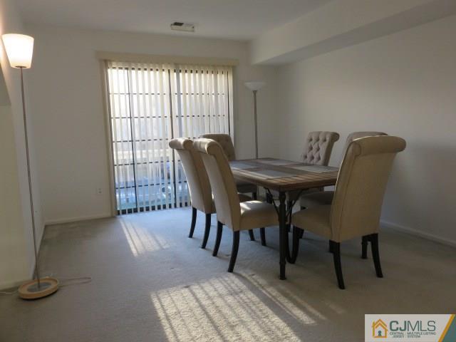 5006 Stonehedge Road Edison, NJ 08820 - Photo 14 of 14 a view of a dining room with furniture and window