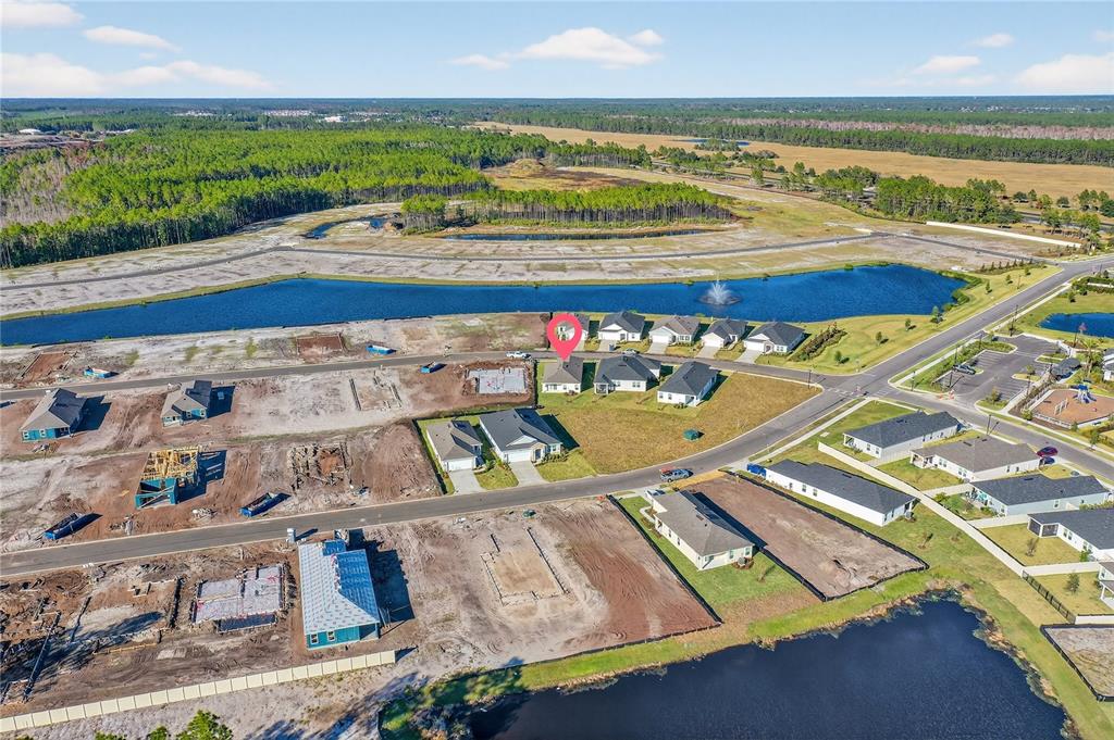 91 Tea Olive Drive Palm Coast, FL 32137 - Photo 16 of 18 a view of a pool a dinning table and chairs