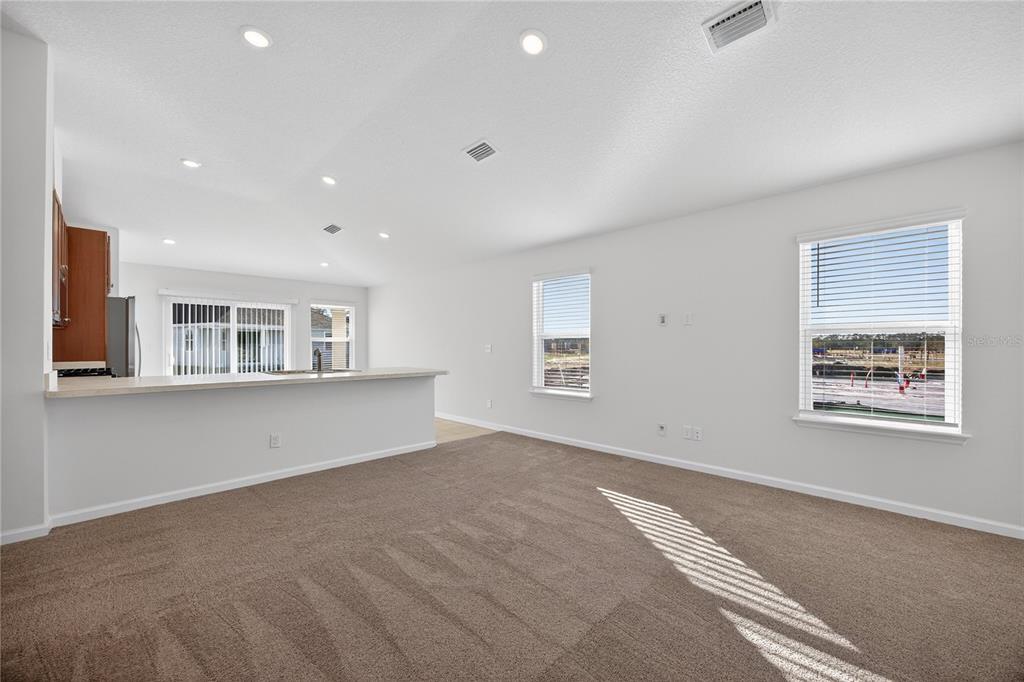 91 Tea Olive Drive Palm Coast, FL 32137 - Photo 5 of 18 a view of an empty room with a window
