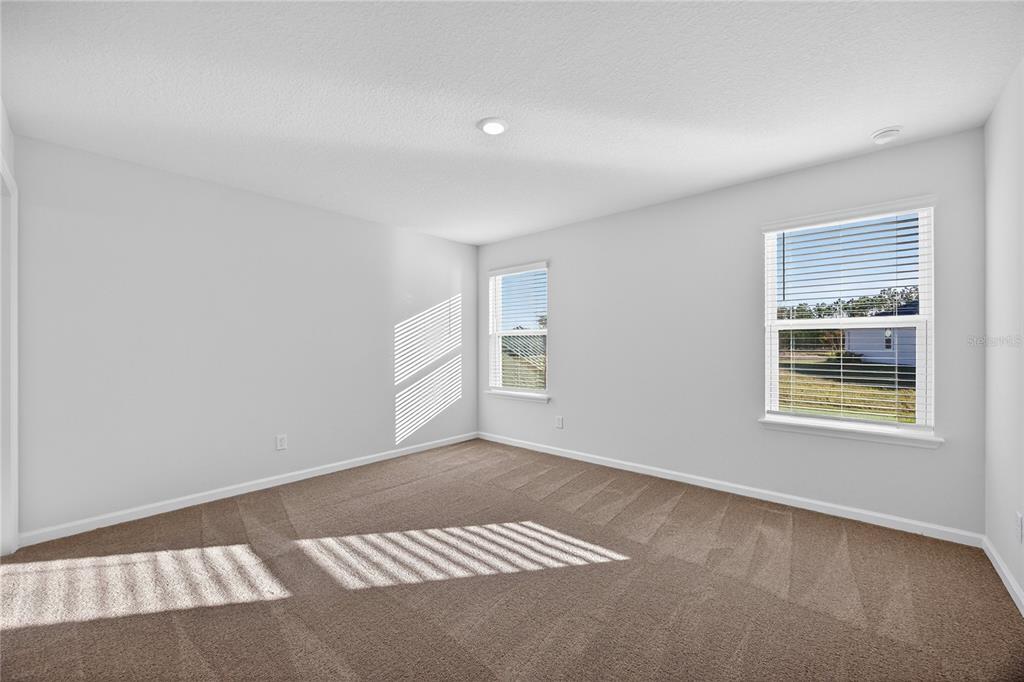 91 Tea Olive Drive Palm Coast, FL 32137 - Photo 8 of 18 a view of an empty room and window