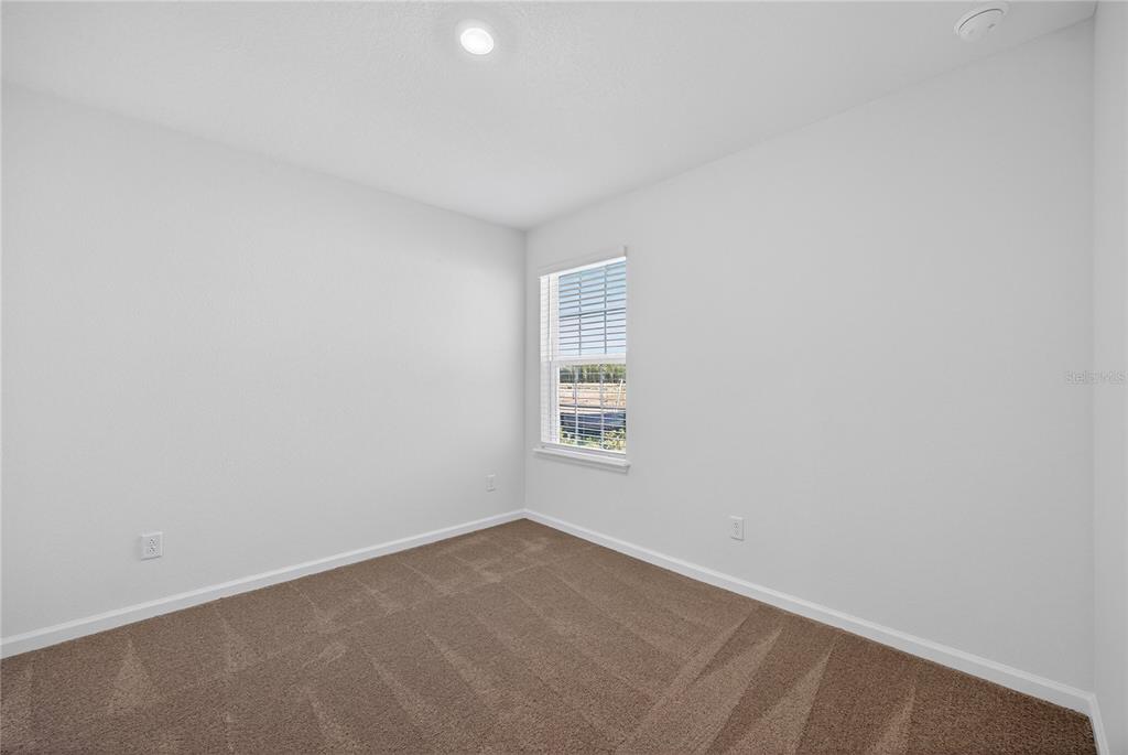 91 Tea Olive Drive Palm Coast, FL 32137 - Photo 10 of 18 an empty room with a window