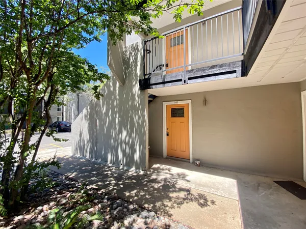 a view of a house with a tree