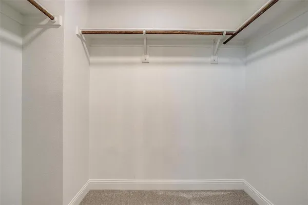 a view of an empty walk in closet