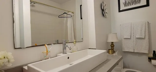 a bathroom with a tub and a sink