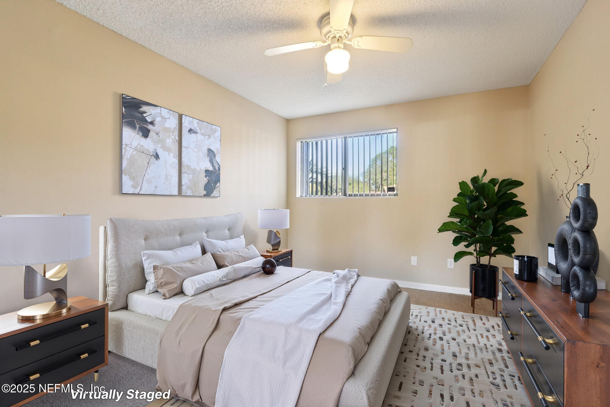 3801 Crown Point Road, Unit 2212 Jacksonville, FL 32257 - Photo 13 of 25 a bedroom with a large bed and a chandelier