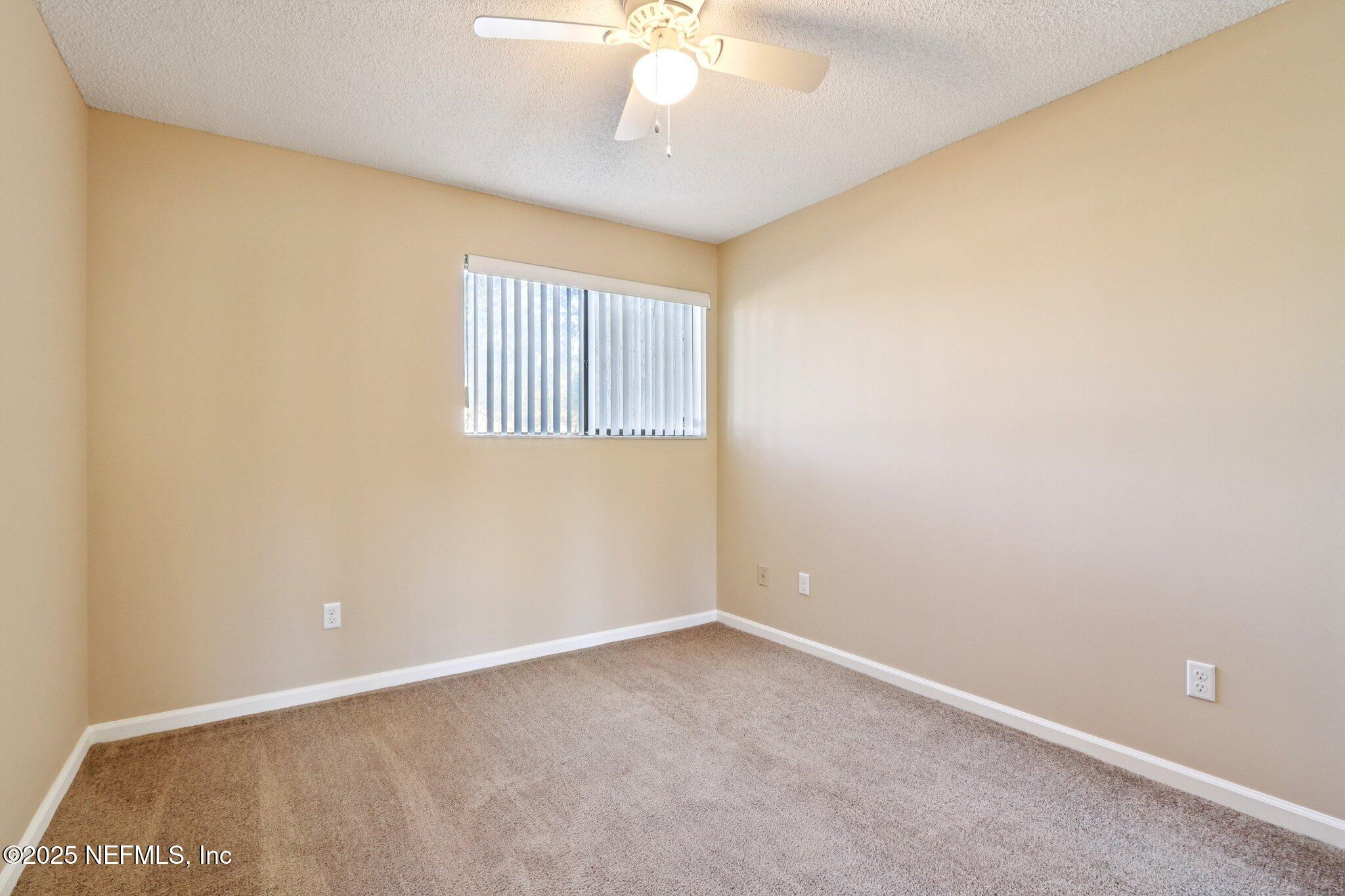 3801 Crown Point Road, Unit 2212 Jacksonville, FL 32257 - Photo 17 of 25 an empty room with a window