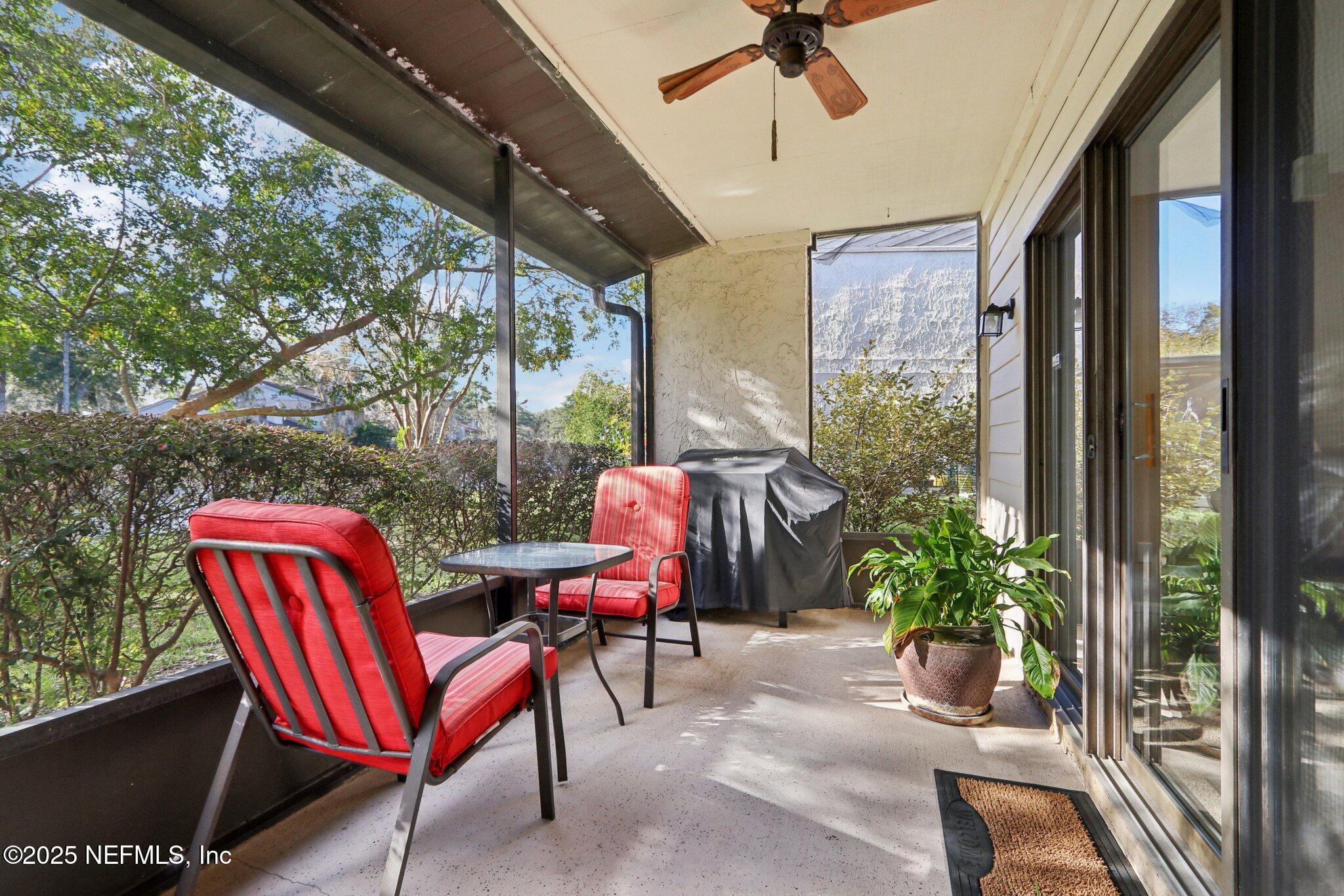3801 Crown Point Road, Unit 2212 Jacksonville, FL 32257 - Photo 18 of 25 a patio with yard glass top table and chairs