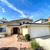 a front view of a house with yard
