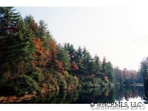 0 Hiwassee Road, Unit 5/4 Lake Toxaway, NC 28747 - Photo 1 of 5 a view of a lake in between two of trees
