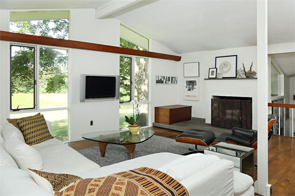 5 Old Conant Road Lincoln, MA 01773 - Photo 6 of 15 a living room with furniture a flat screen tv and a fireplace