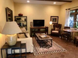 Undisclosed Address Montecito, CA 93108 - Photo 3 of 11 a living room with furniture and a flat screen tv