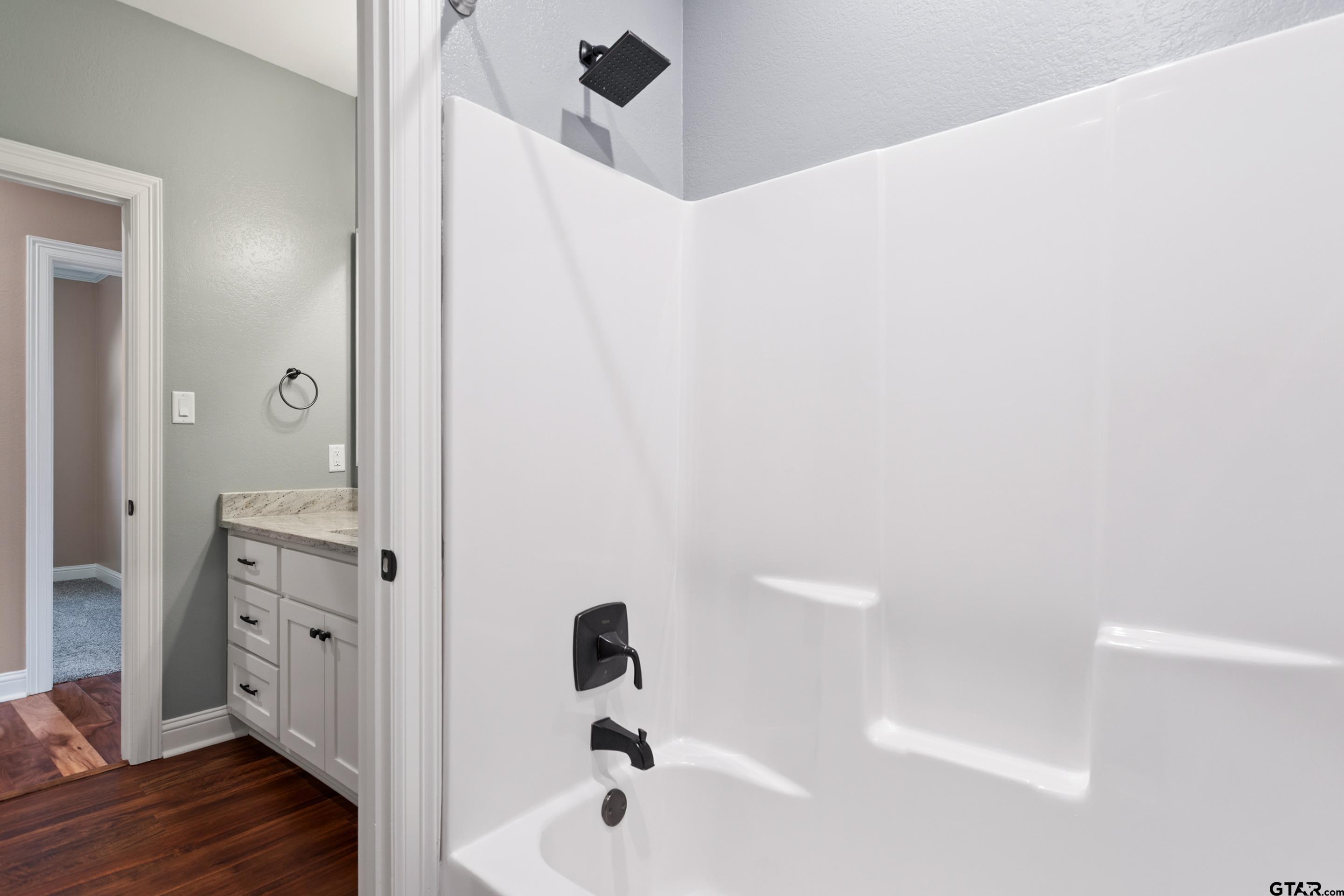 105 Nathan Road Chandler, TX 75758 - Photo 23 of 36 a bathroom with a bathtub and shower