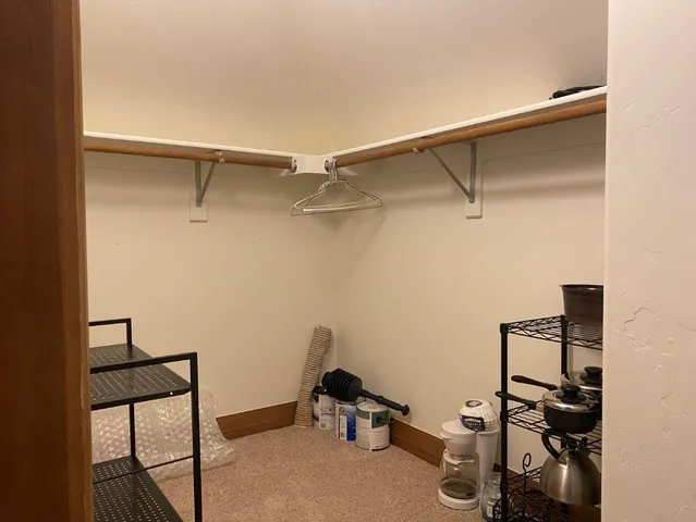 a room with gym equipment and a view of living area