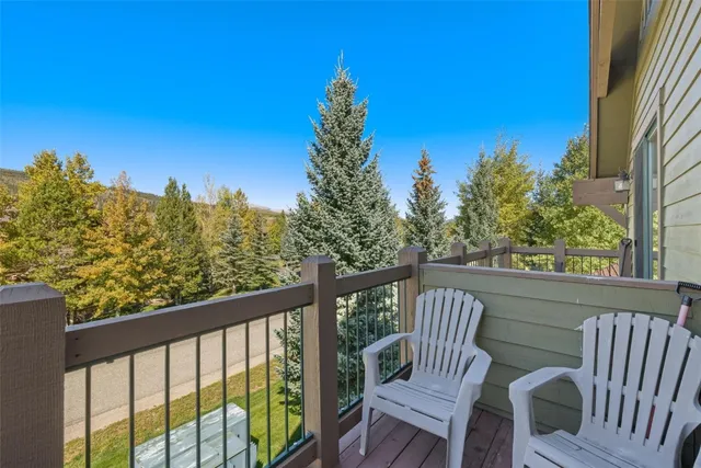 a view of a two chairs in the balcony