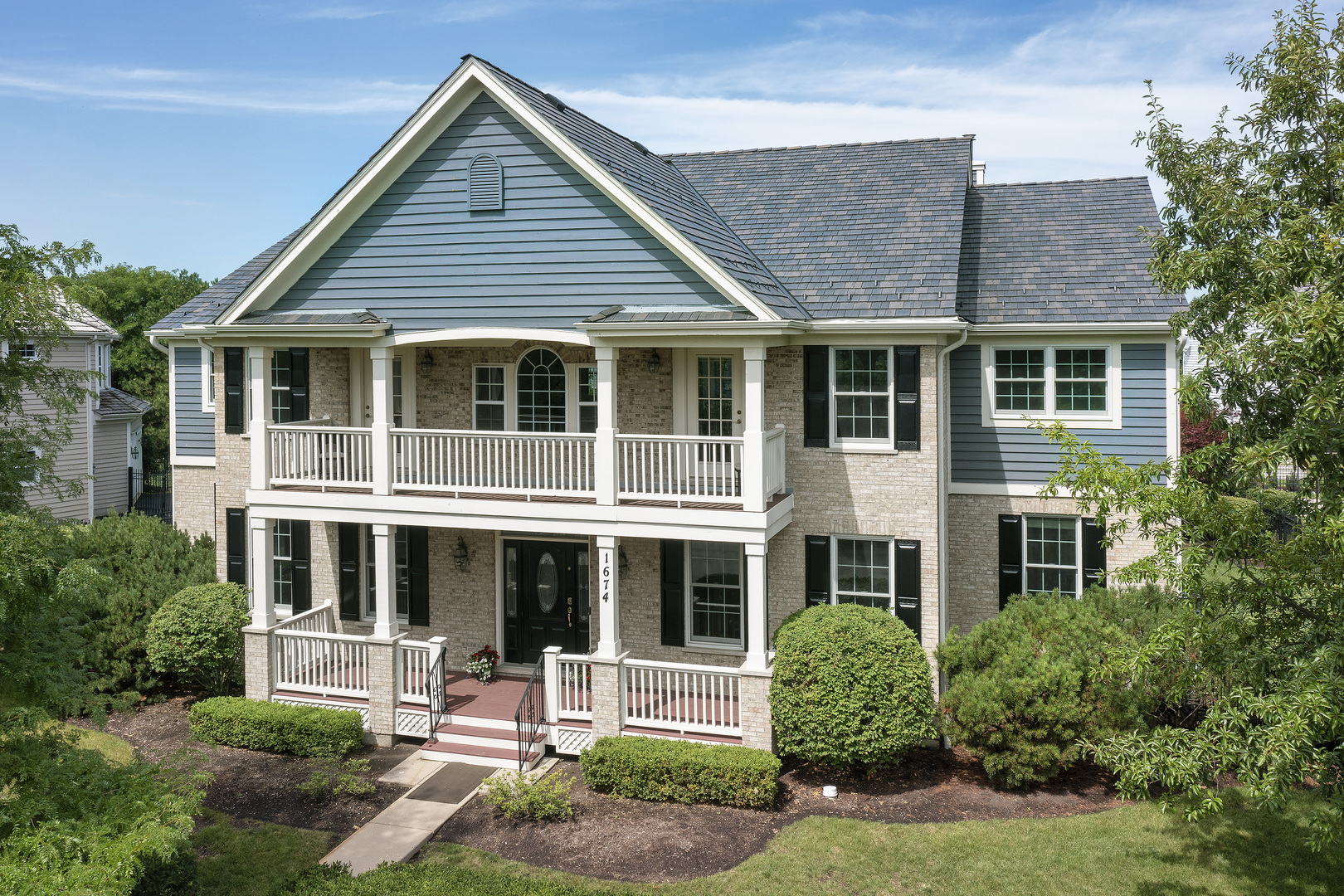 front view of a house with a yard