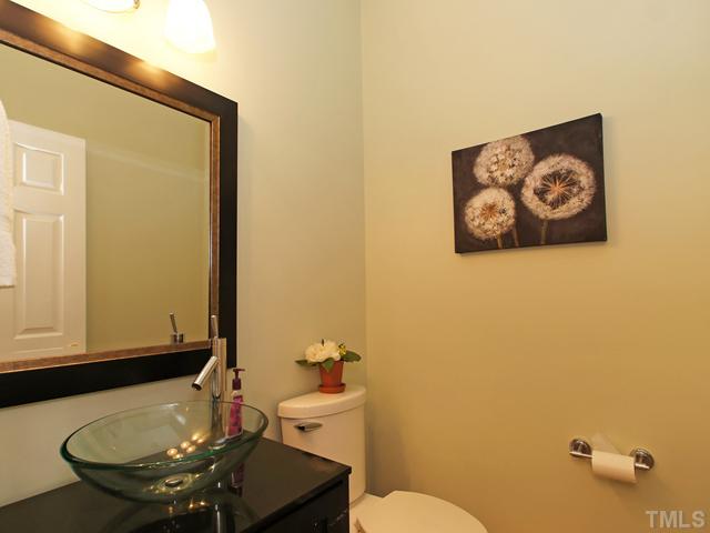 740 Rockville Road Wake Forest, NC 27587 - Photo 11 of 25 a bathroom with a sink and a mirror