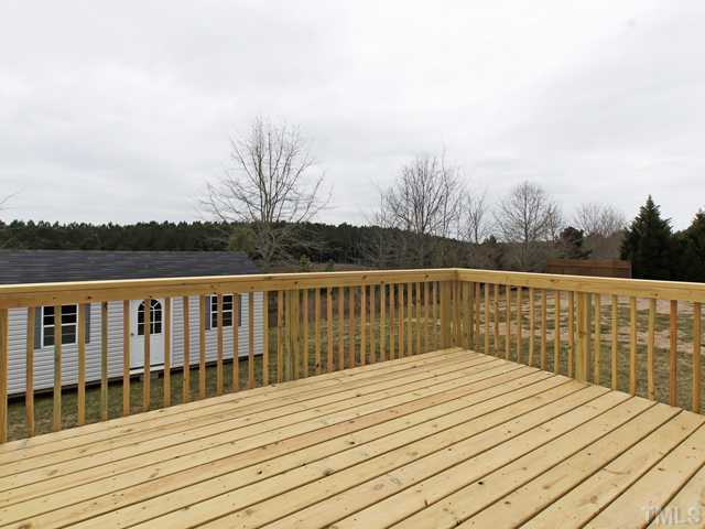 740 Rockville Road Wake Forest, NC 27587 - Photo 20 of 25 a view of balcony with wooden floor and fence