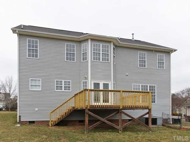 740 Rockville Road Wake Forest, NC 27587 - Photo 22 of 25 a view of a house with a wooden deck