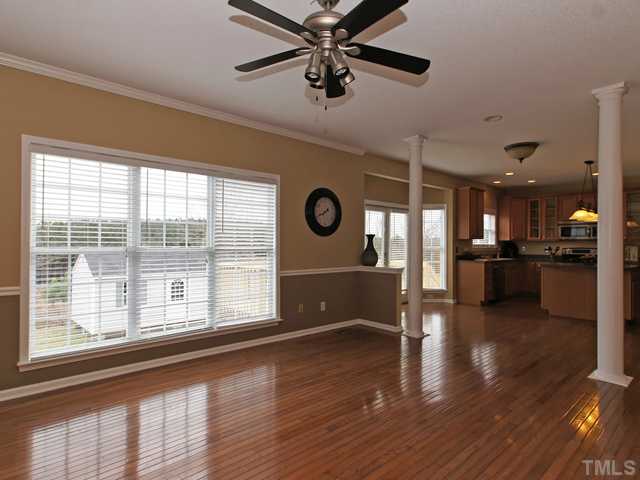 740 Rockville Road Wake Forest, NC 27587 - Photo 25 of 25 a view of a livingroom with furniture hardwood floor and a large window