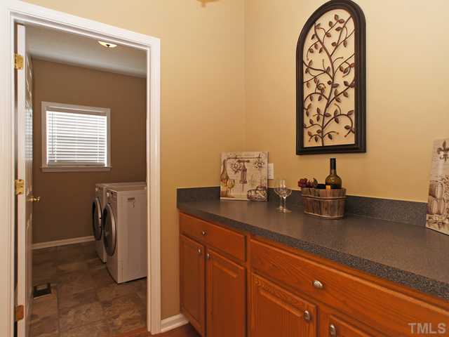 740 Rockville Road Wake Forest, NC 27587 - Photo 9 of 25 a bathroom with a sink a vanity and a mirror