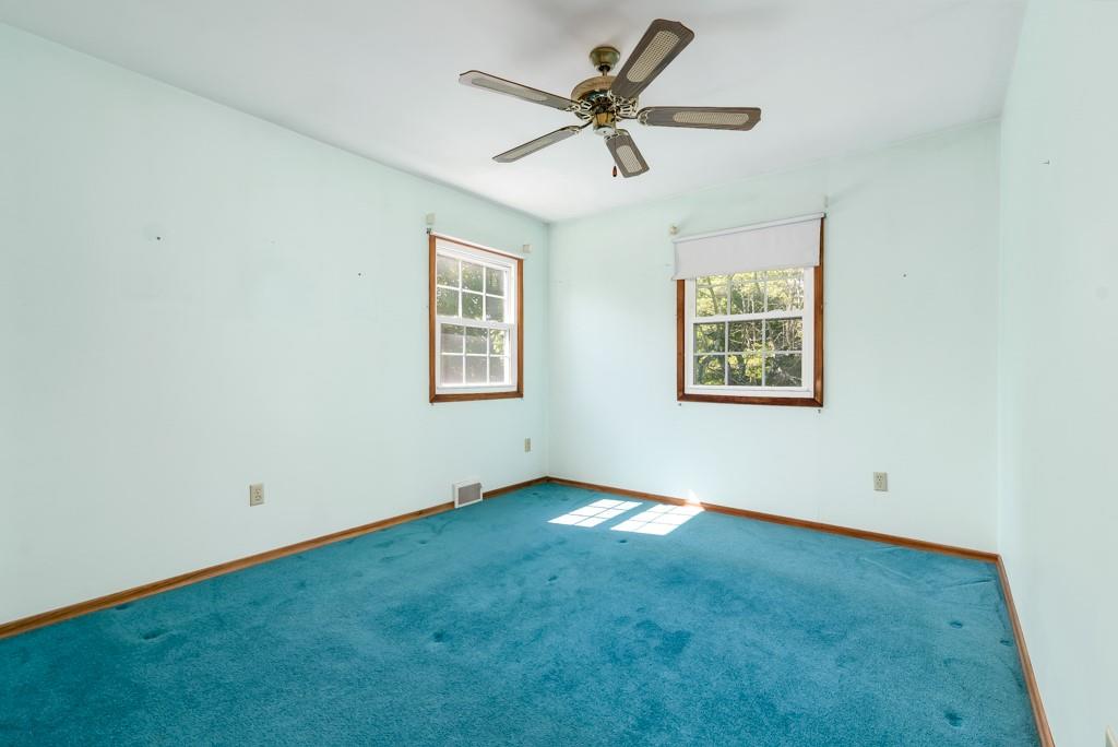 2167 Butler Logan Road Tarentum, PA 15084 - Photo 18 of 25 an empty room with a window and a fan