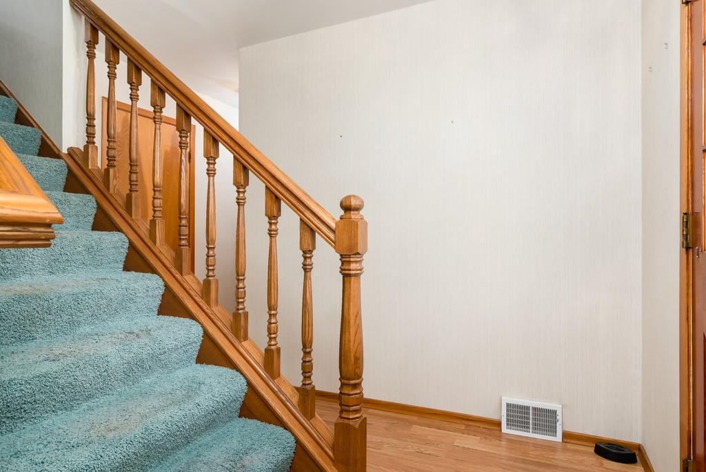 2167 Butler Logan Road Tarentum, PA 15084 - Photo 4 of 25 a view of staircase with wooden floor and white walls