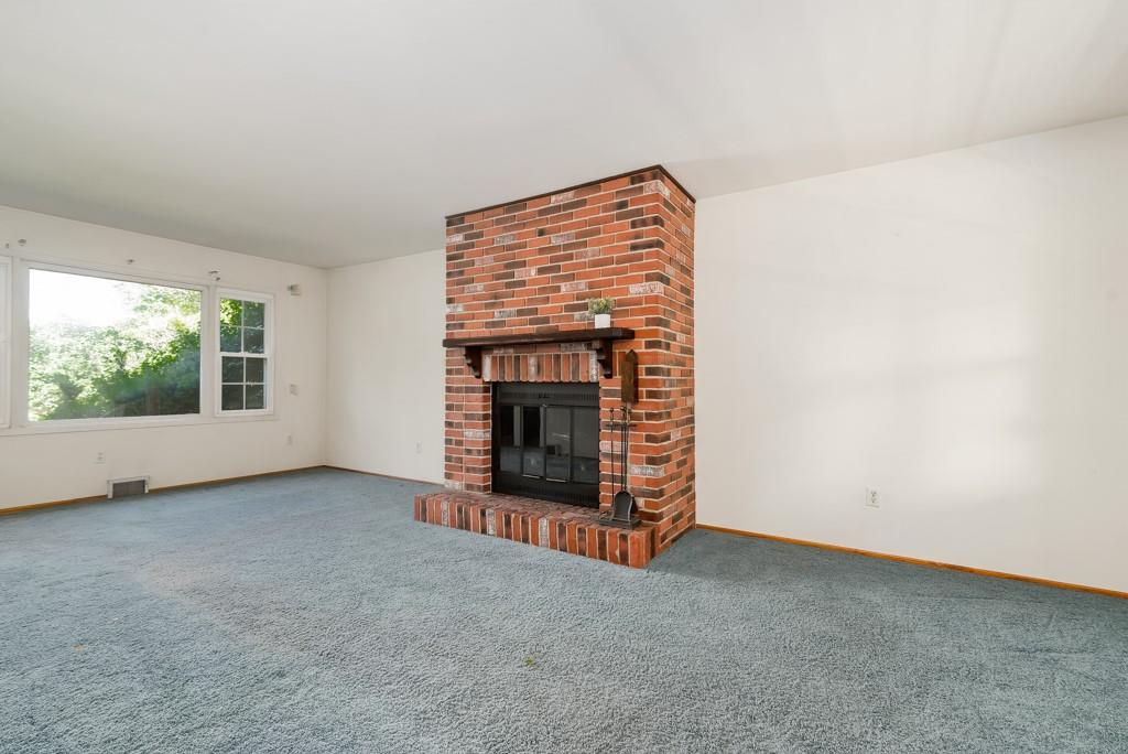 2167 Butler Logan Road Tarentum, PA 15084 - Photo 5 of 25 an empty room with a fireplace