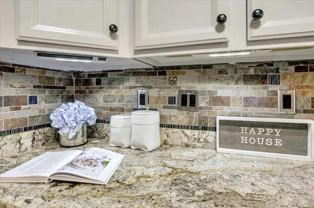 a kitchen with a stove a sink and a cabinets