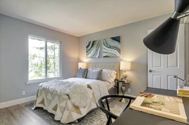 a bedroom with a bed and window