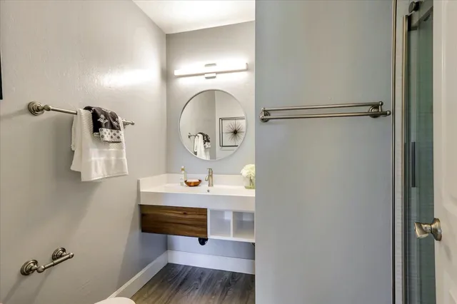 a bathroom with a sink and mirror