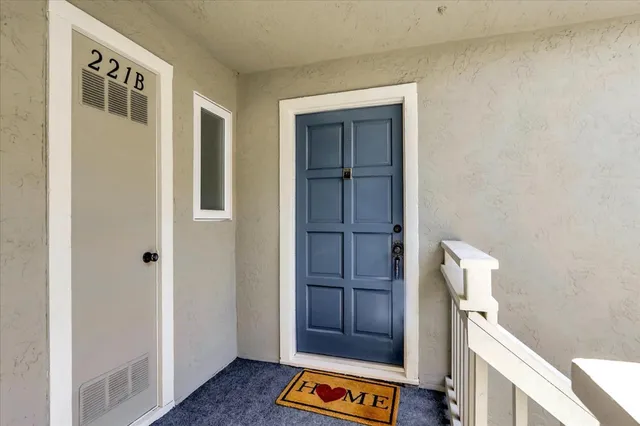 a view of an entryway with wooden floor