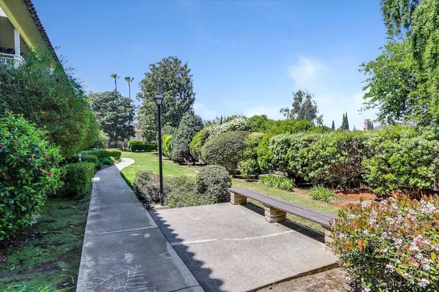 a front view of a building with a swimming pool