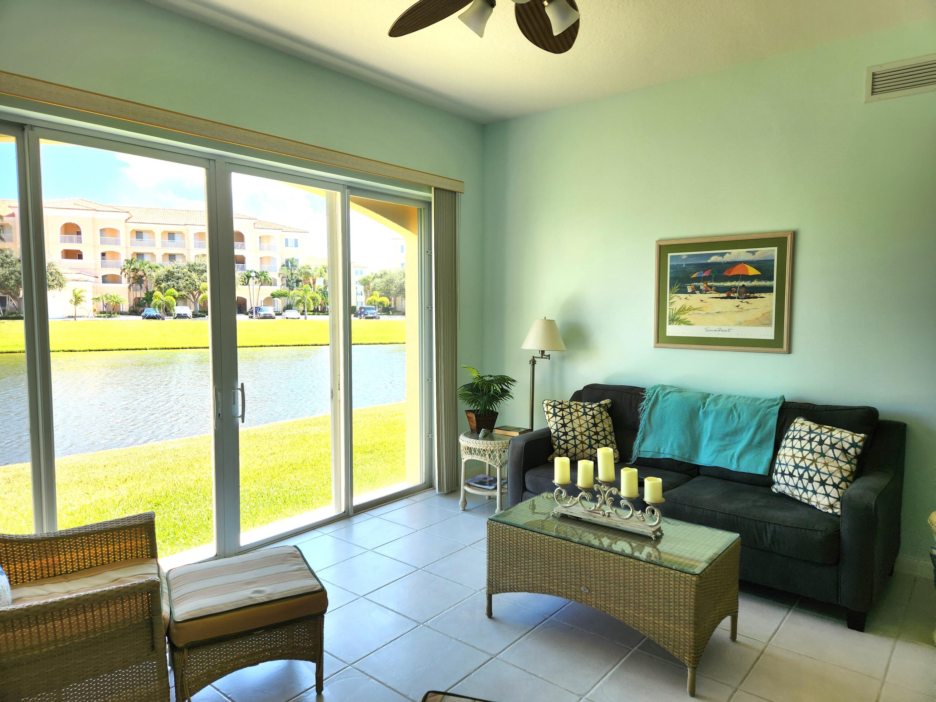 1 Harbour Isle Drive East, Unit 104 Fort Pierce, FL 34949 - Photo 11 of 28 a living room with furniture and a large window