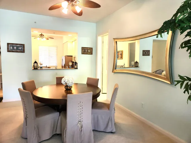a dining room with furniture and window