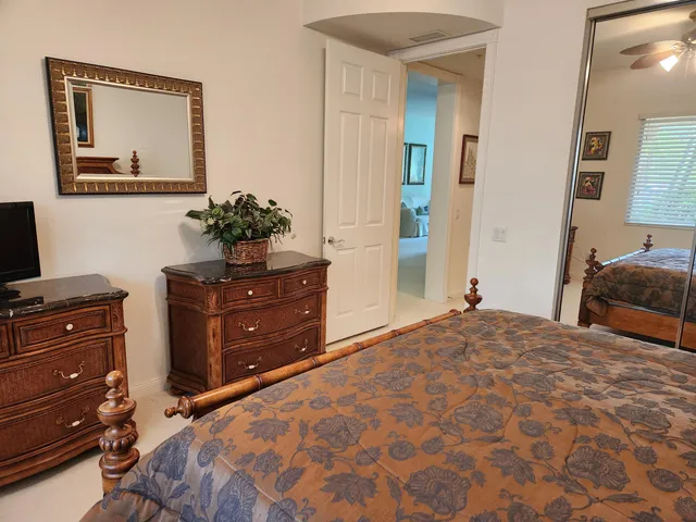 a bedroom with a bed and a dresser