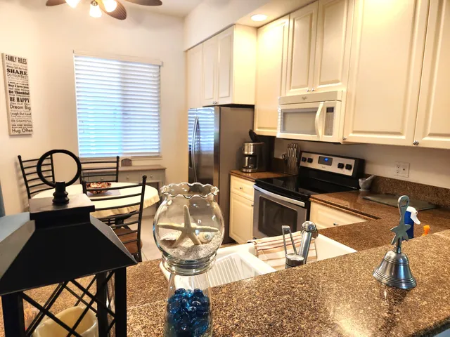 a kitchen with stainless steel appliances granite countertop a stove and a sink