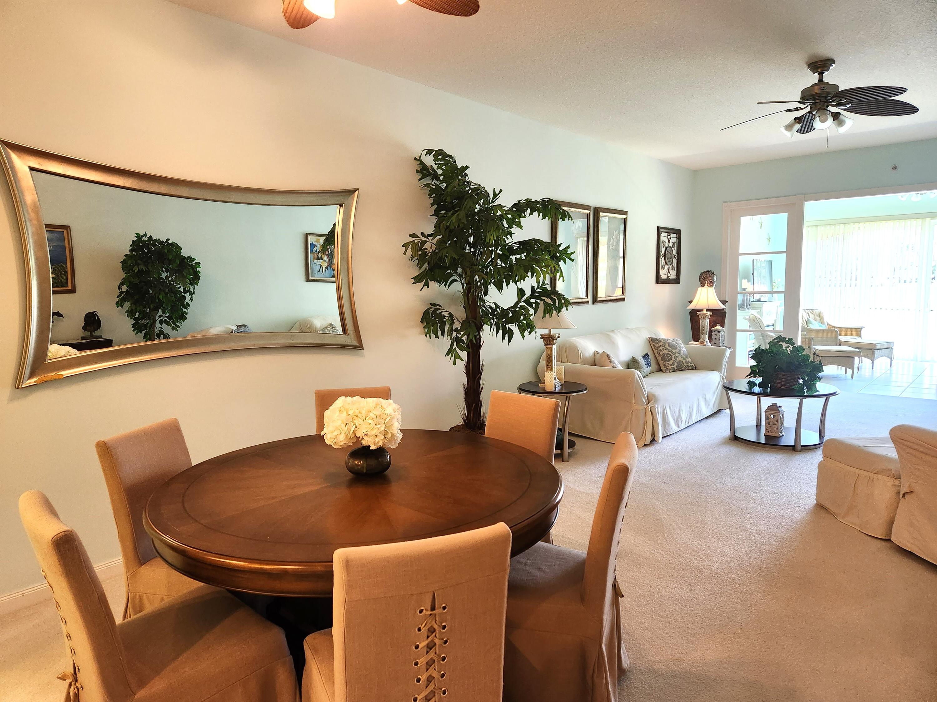 1 Harbour Isle Drive East, Unit 104 Fort Pierce, FL 34949 - Photo 7 of 28 a dining room with furniture and window