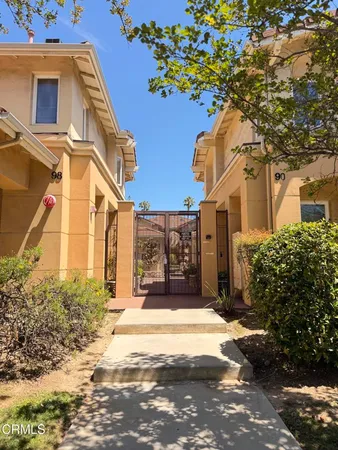 a view of a house with a small yard