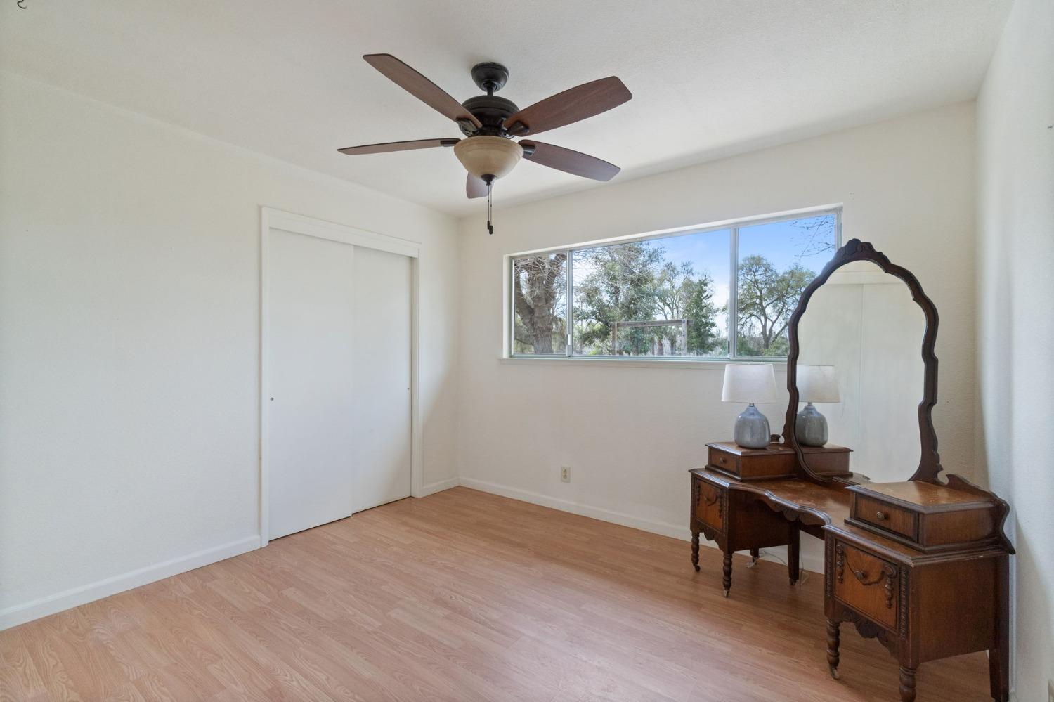 2244 Tivy Valley Road Sanger, CA 93657 - Photo 20 of 44 a view of a workspace with furniture and a window